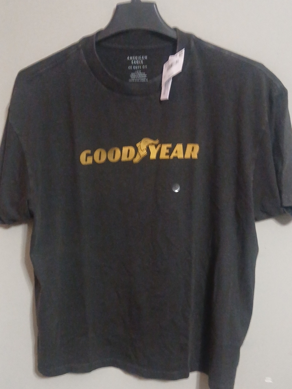 American Eagle Outfitters Black Tee with Gold Goodyear Logo